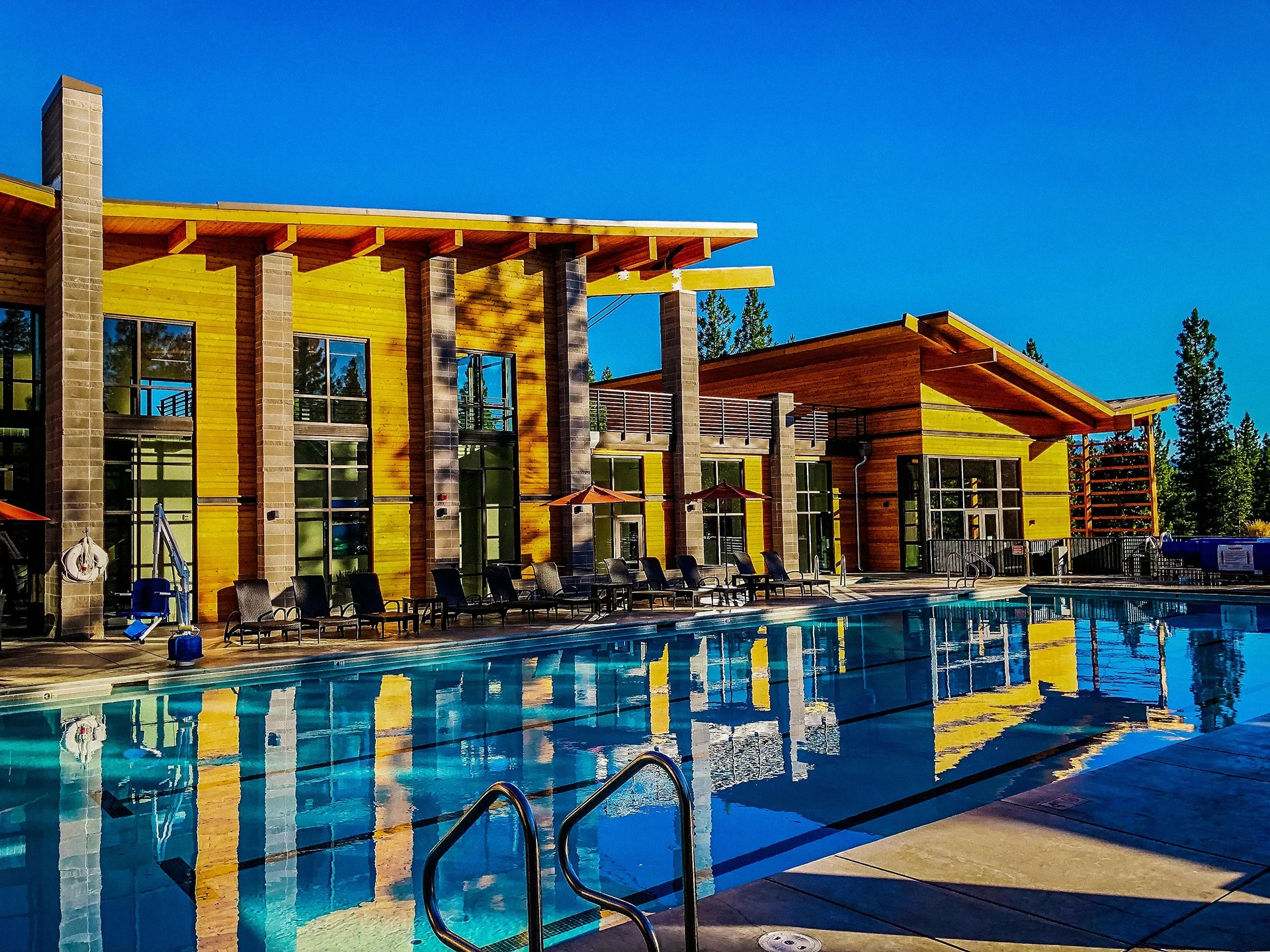 Timber wings reflected in the pool on a clear day