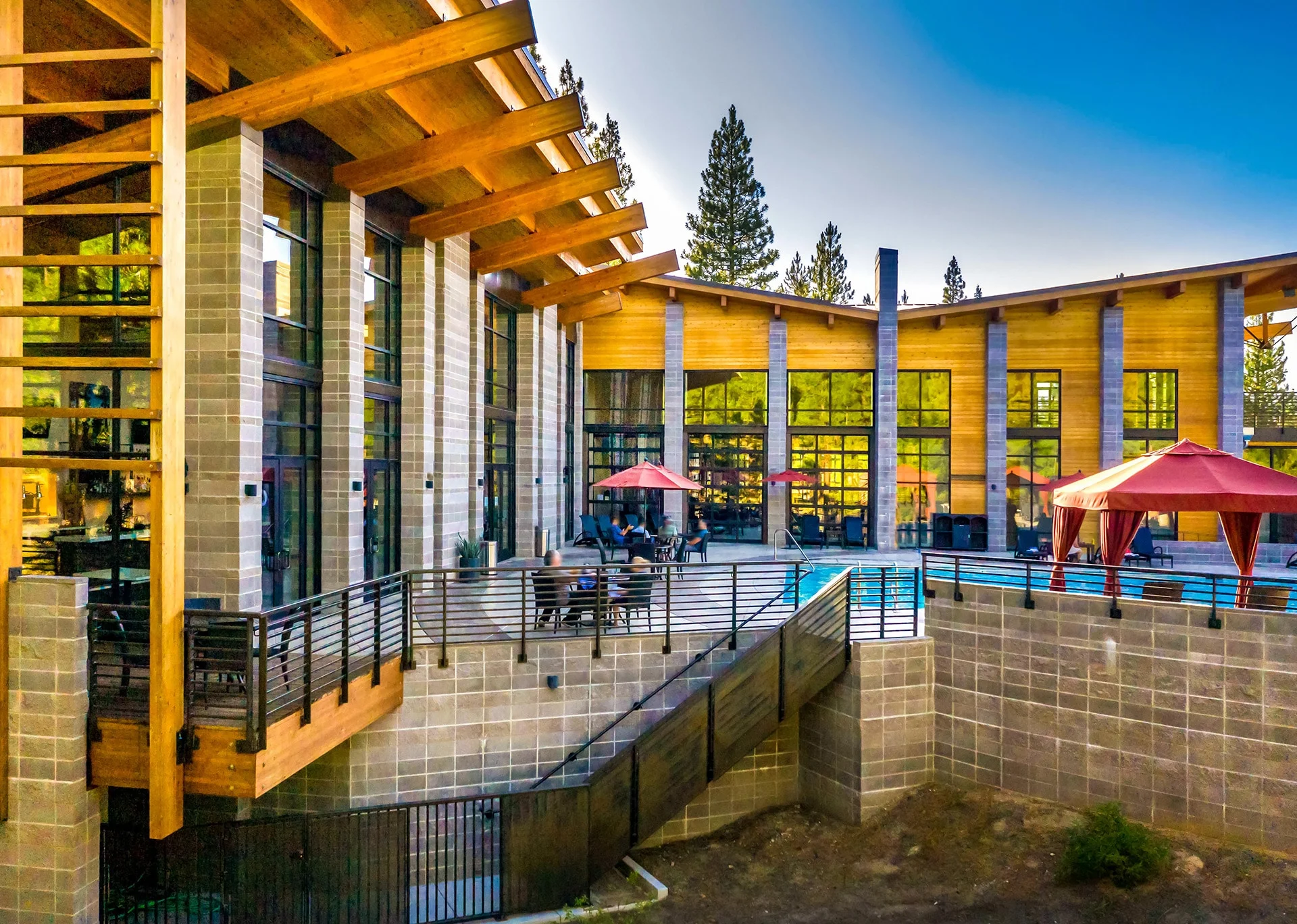 Timber columns and glass facing east to the pool deck