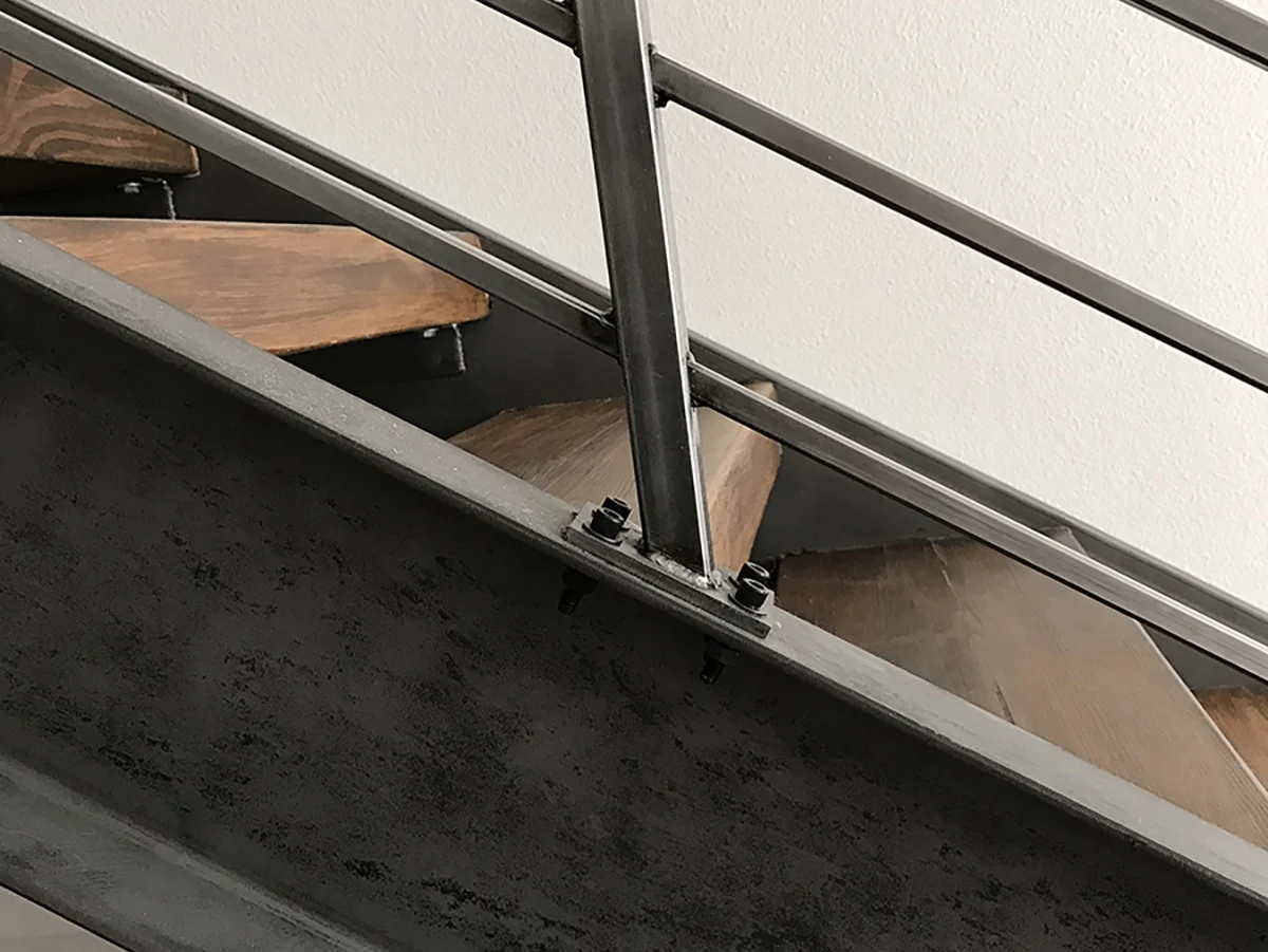 Steel stringer and wood treads of the new open stairway