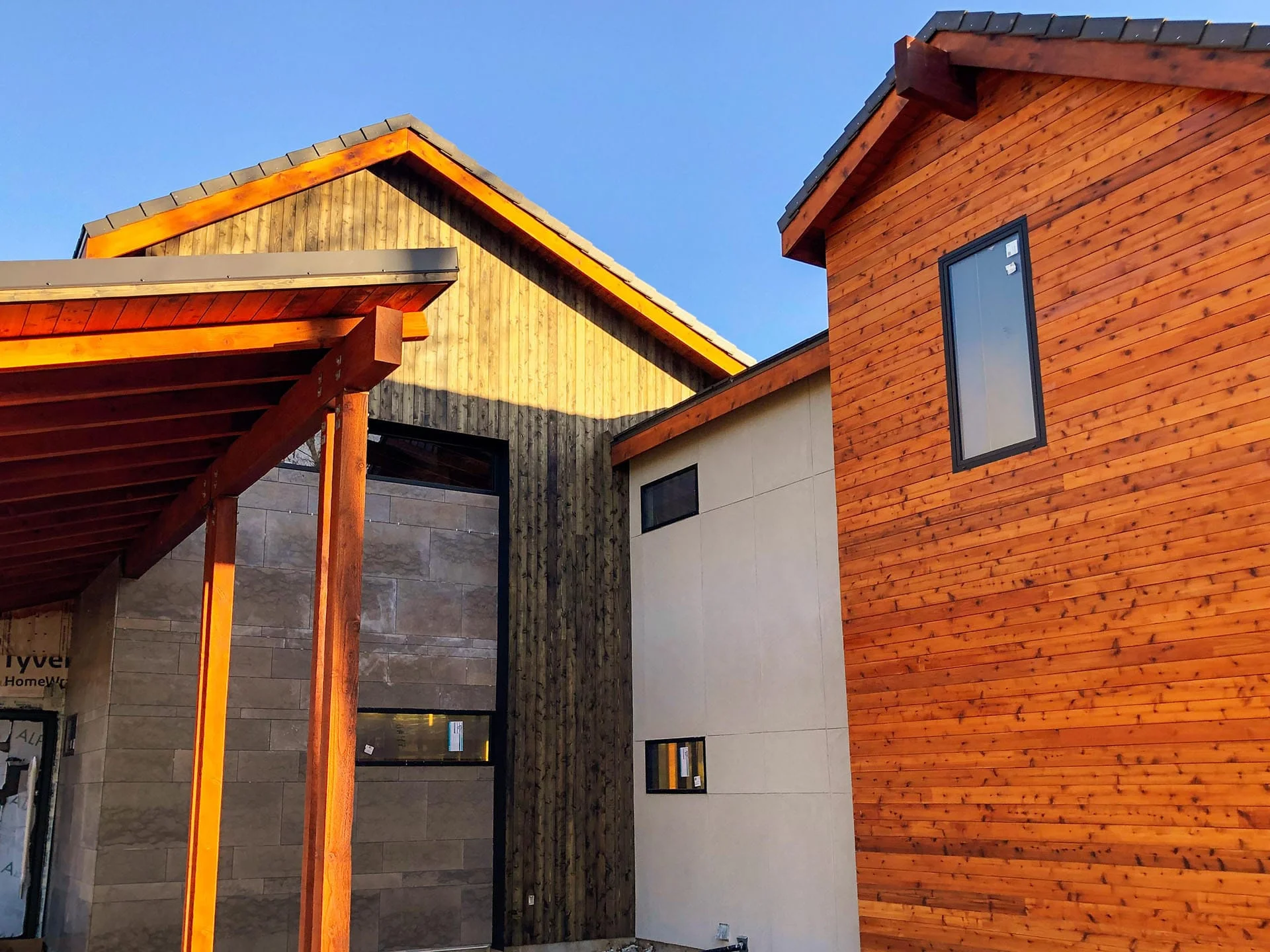 Steep gabled rooflines with cedar siding