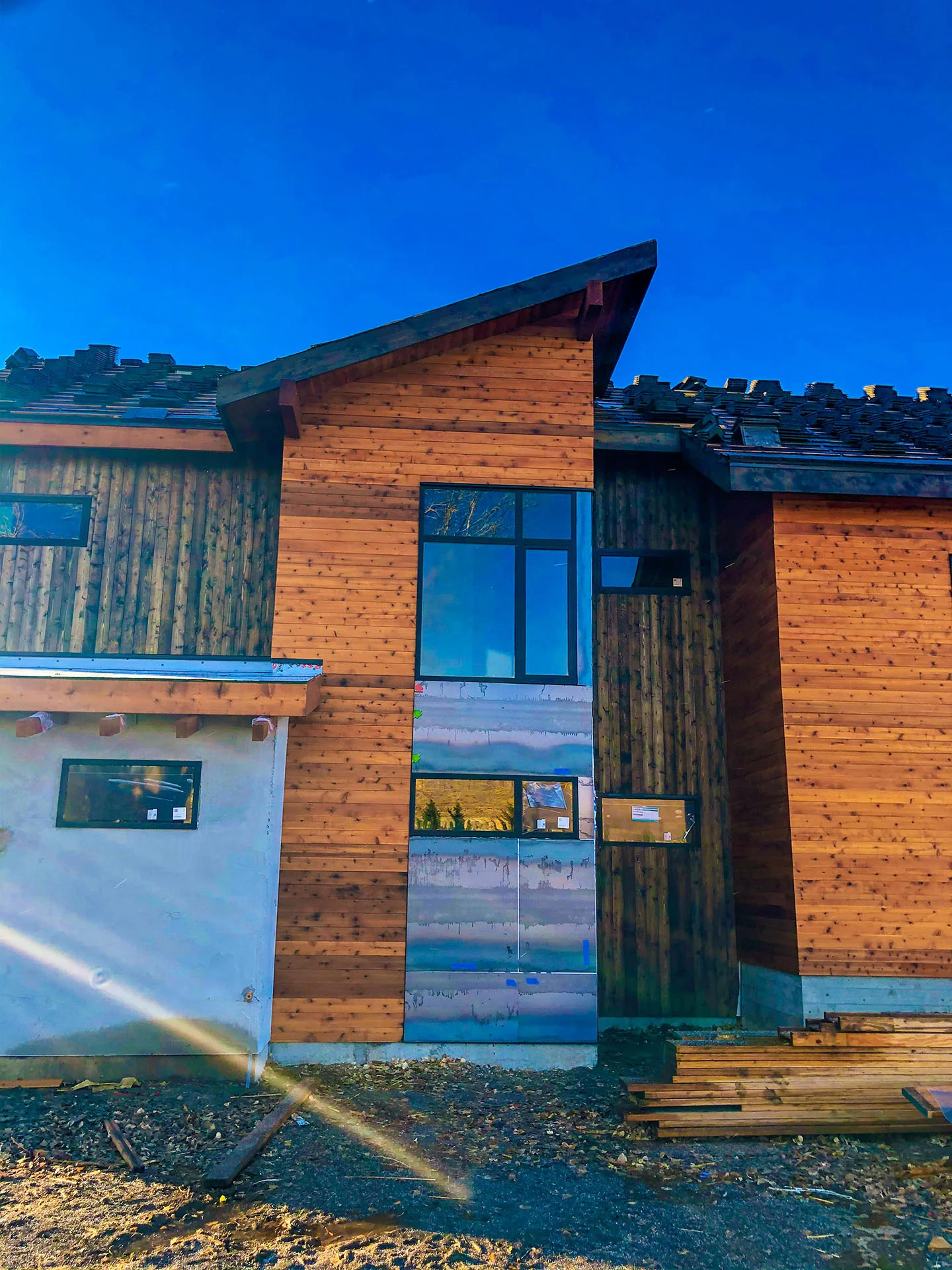 Cedar and stone facade of the residence
