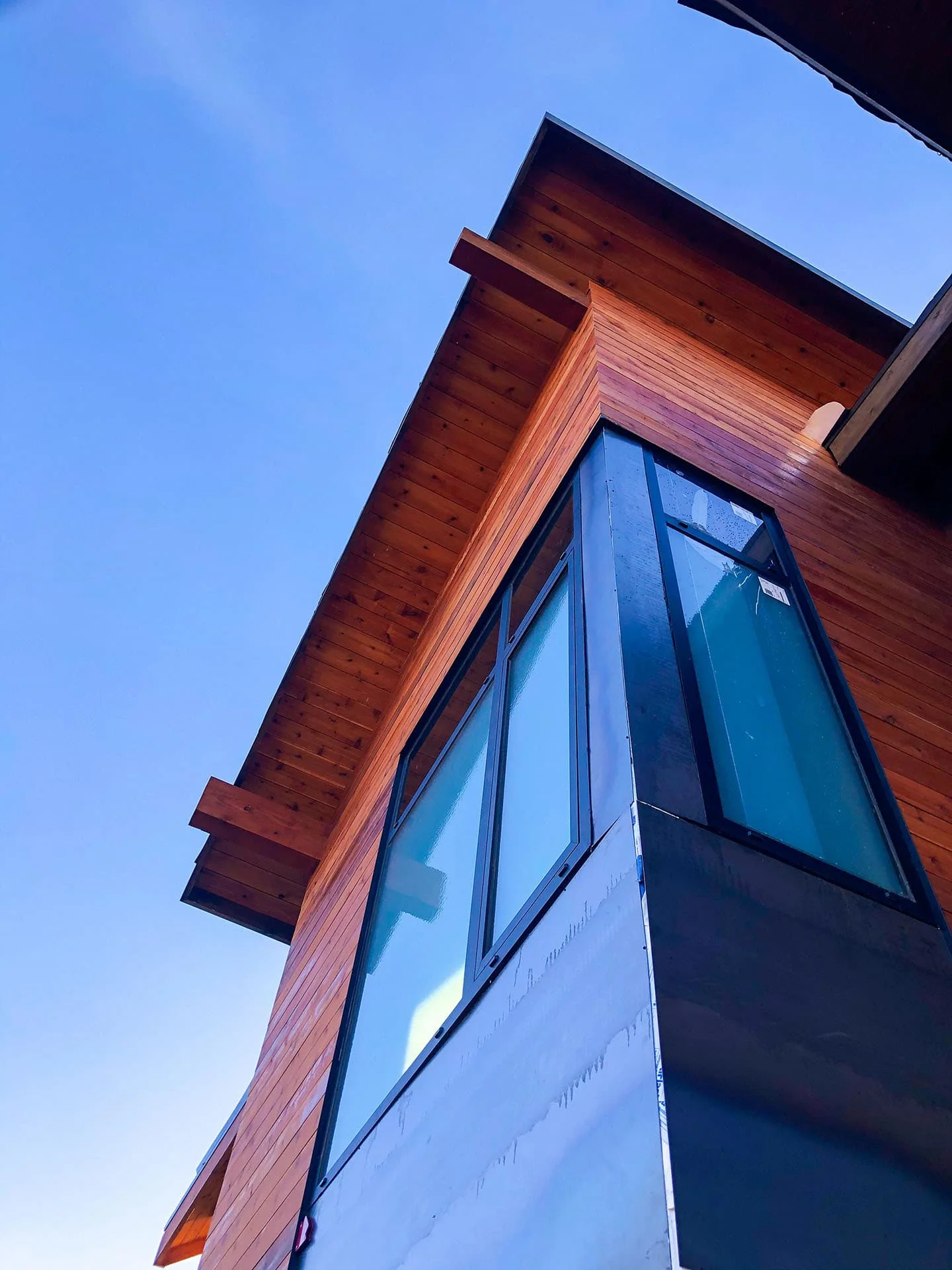 Cedar corner with glazing and deep eave