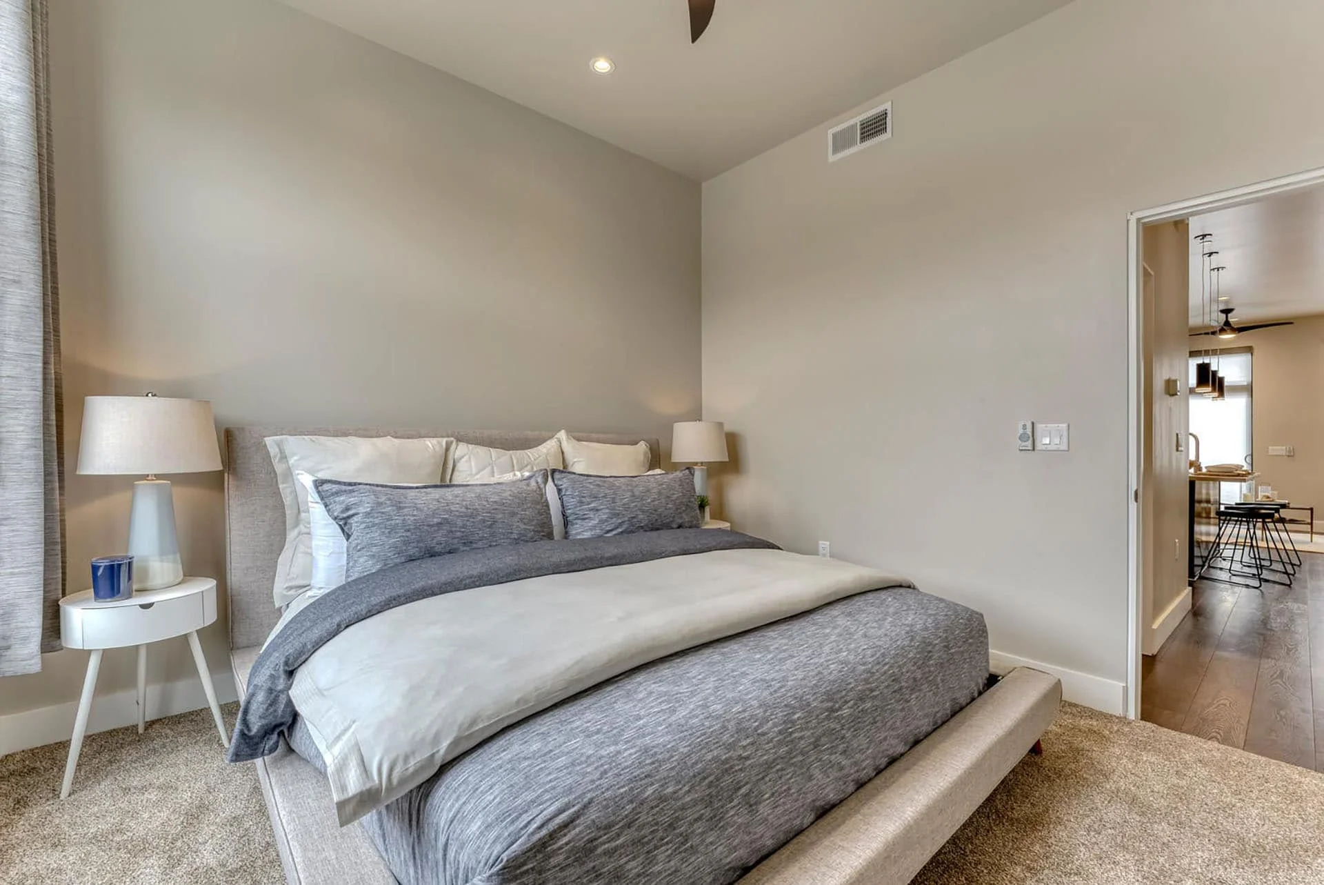 Bedroom with a platform bed and soft neutral finishes