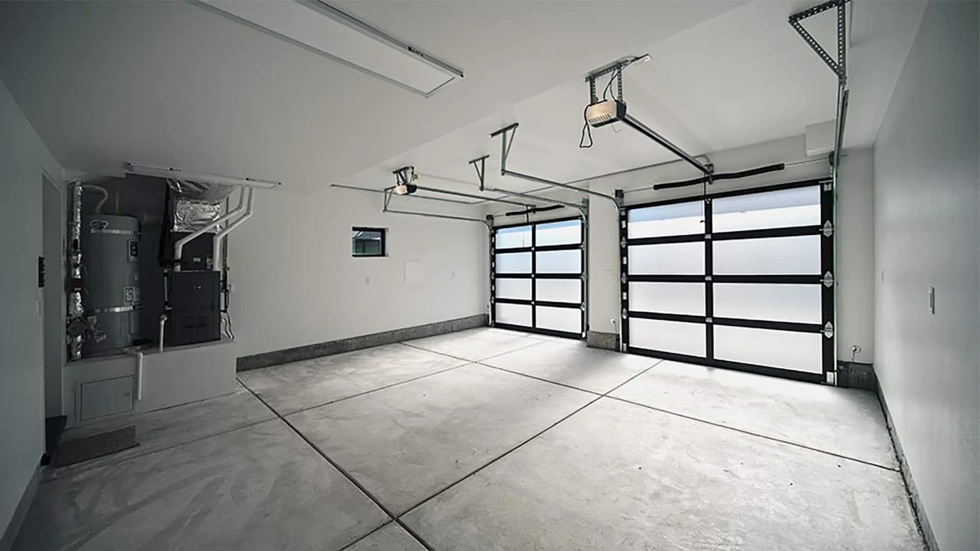 Garage with full-glass sectional doors and polished concrete floor