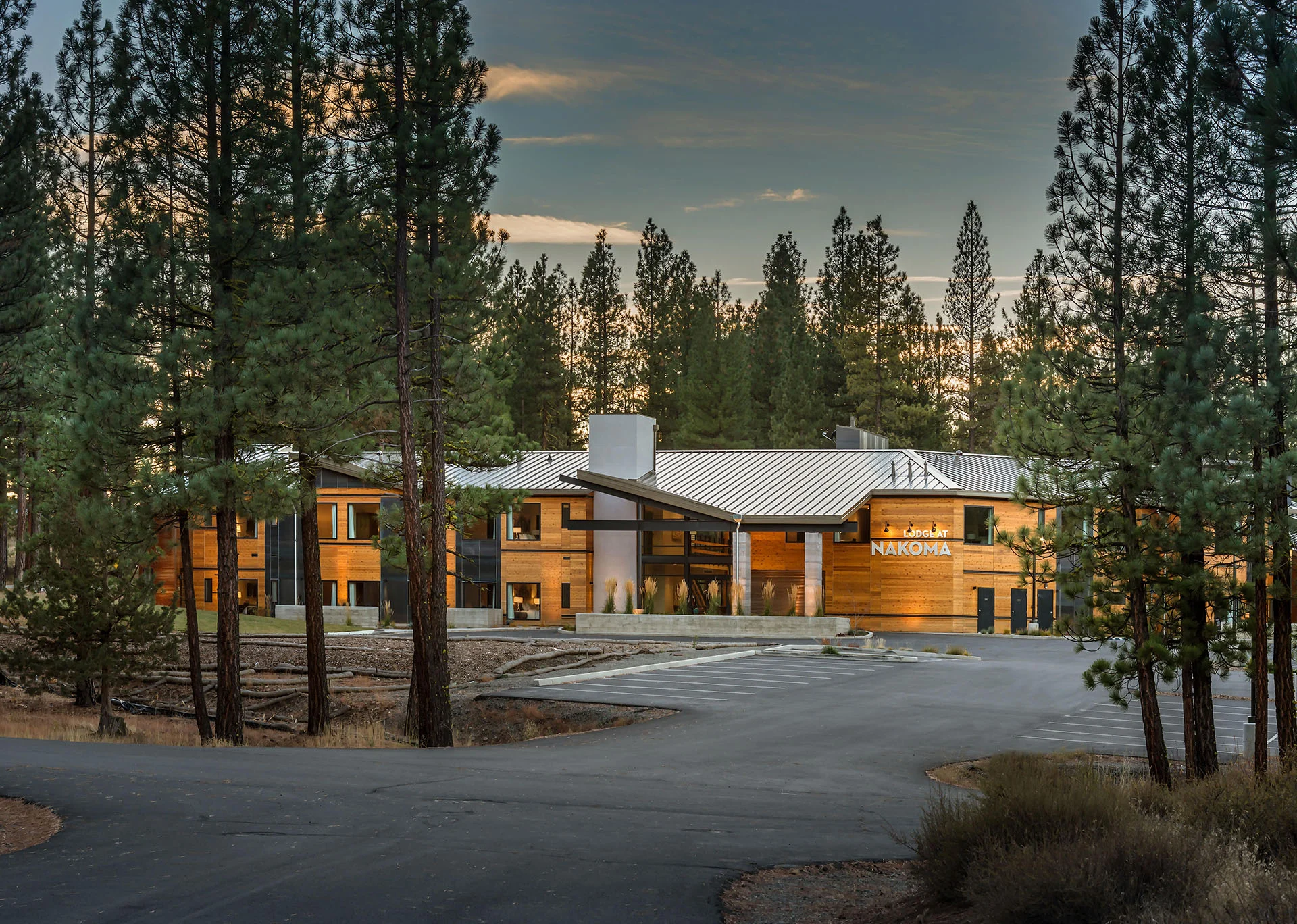 Lodge at Nakoma seen down the drive through tall pines