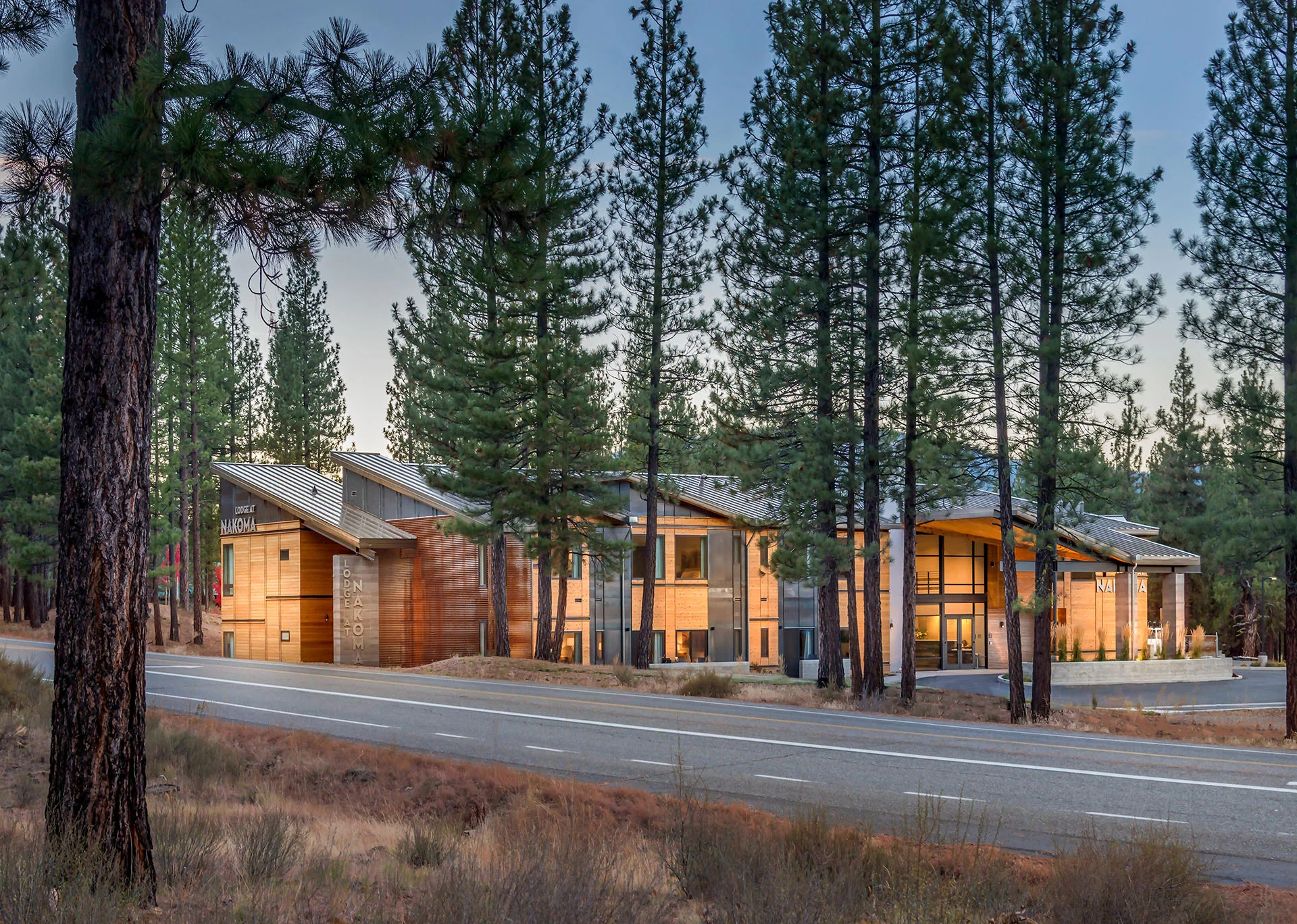Lodge at Nakoma seen from the road through pines